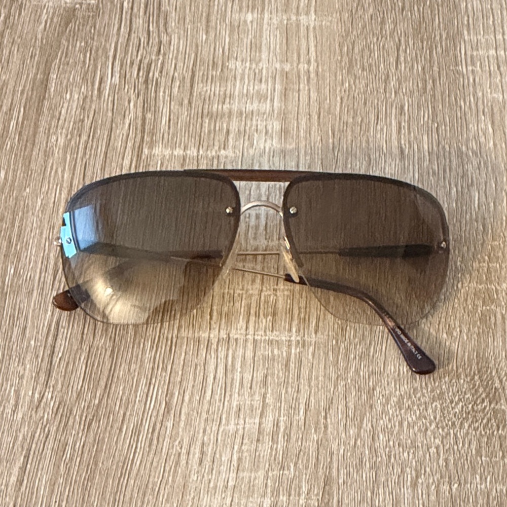 Tom Ford Nils sunglasses, featuring a gold metal frame and brown gradient lenses